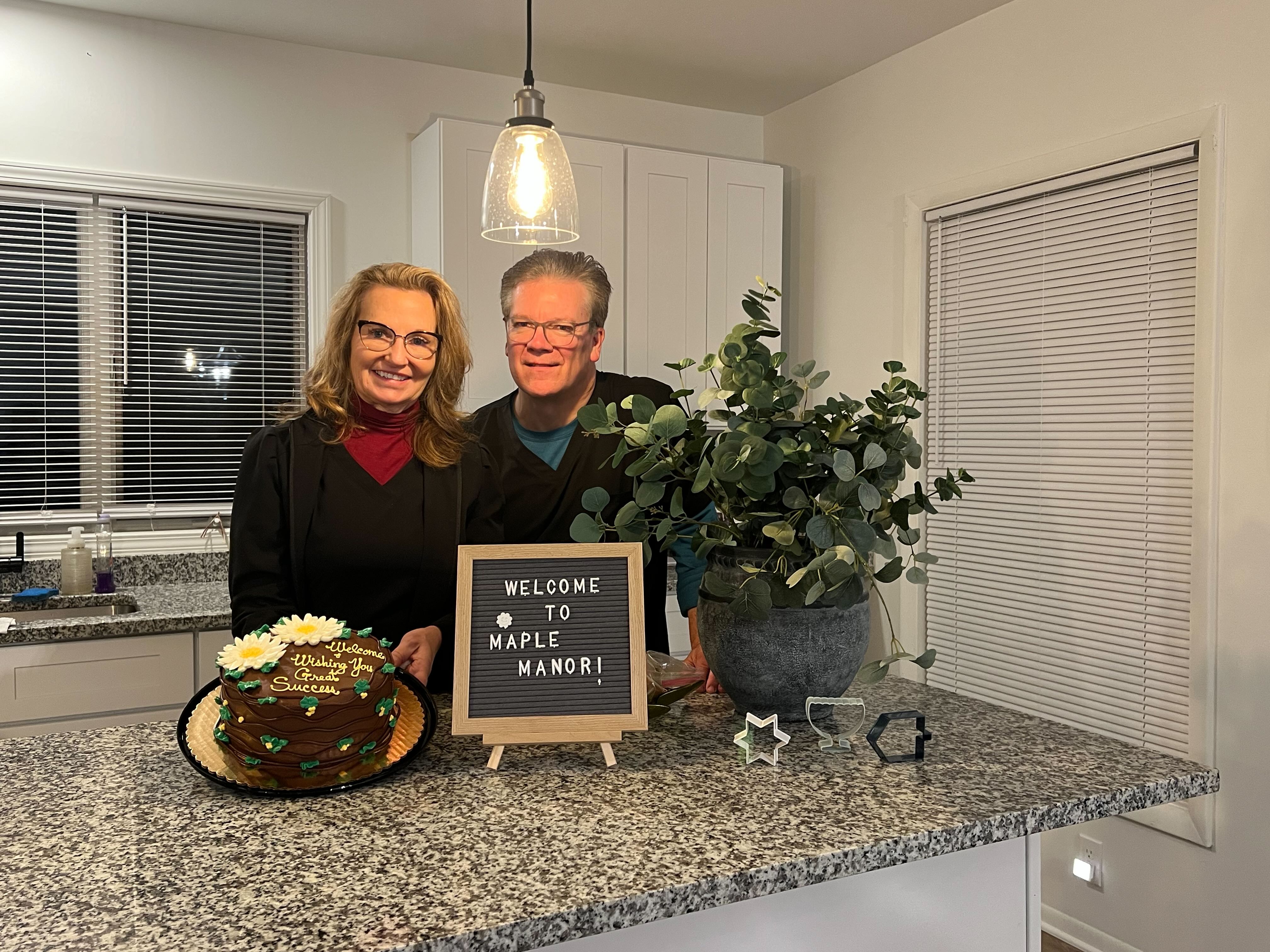 Caregiver and resident sharing a warm moment at Archer Senior Living